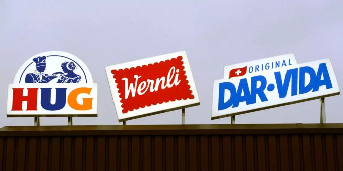 Hug kann den Umsatz nur leicht steigern. Das Logo von Hug, Wernli und Dar Vida