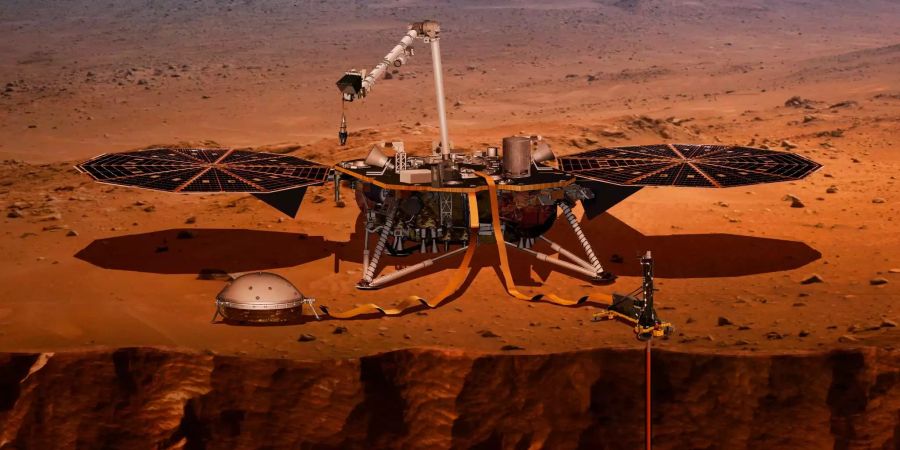 Die von der US-Raumfahrtbehörde Nasa zur Verfügung gestellte Computer-Visualisierung zeigt den Lander «InSight», der auf dem Mars eine Probebohrung durchführt.