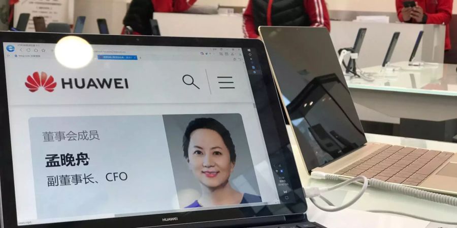 Ein Porträtfoto von Meng Wanzhou, Finanzchefin des Smartphone-Herstellers Huawei, ist auf einem Huawei-Computer zu sehen.