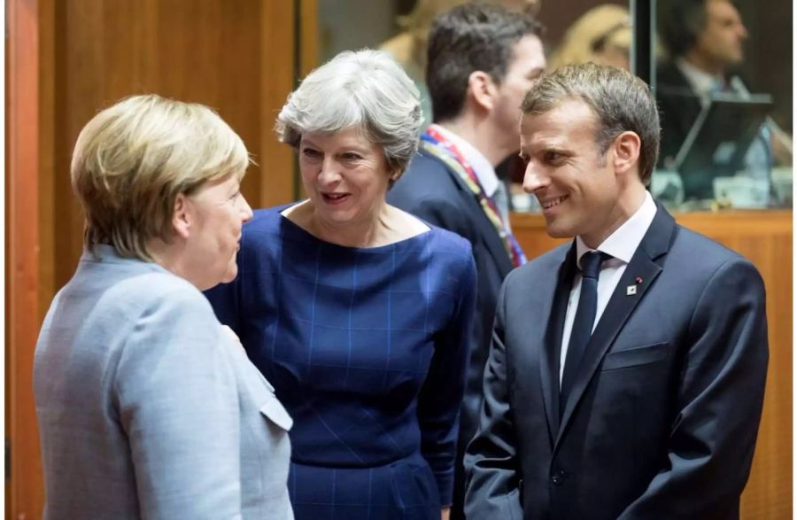 May im Gespräch mit Merkel und Macron.