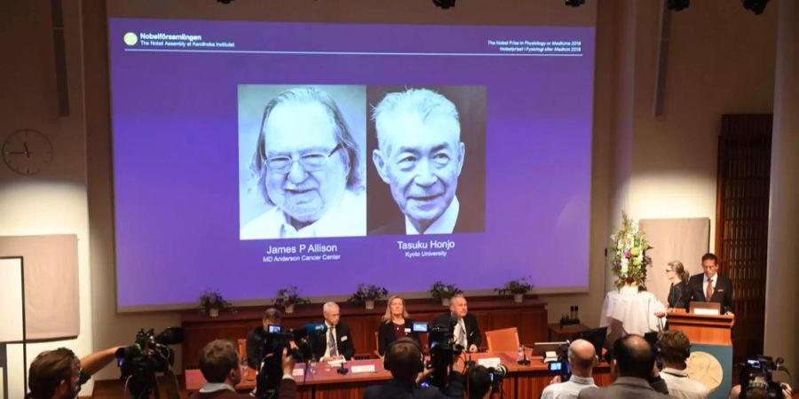 Die Porträts der beiden Gewinner des Nobelpreises für Medizin: James P. Allison und Tasuku Honjo.