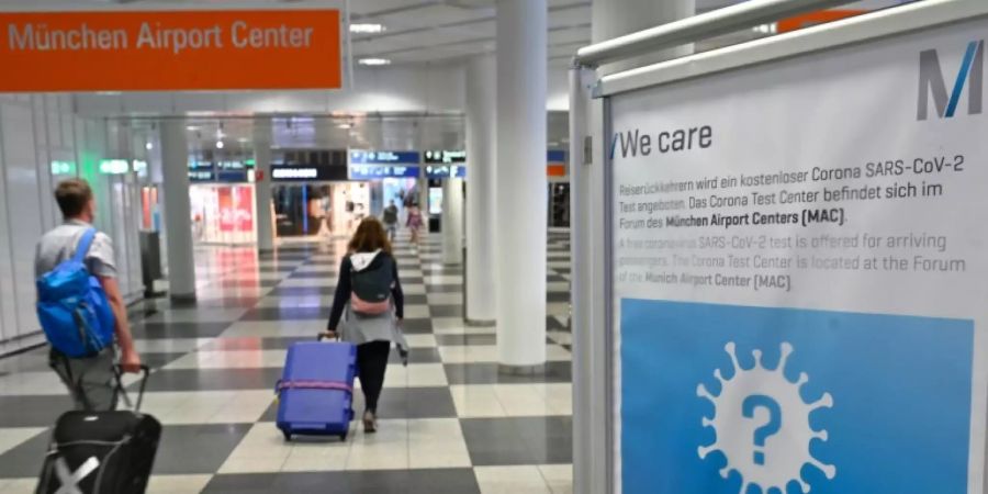 Urlaubsrückkehrer auf dem Fughafen München