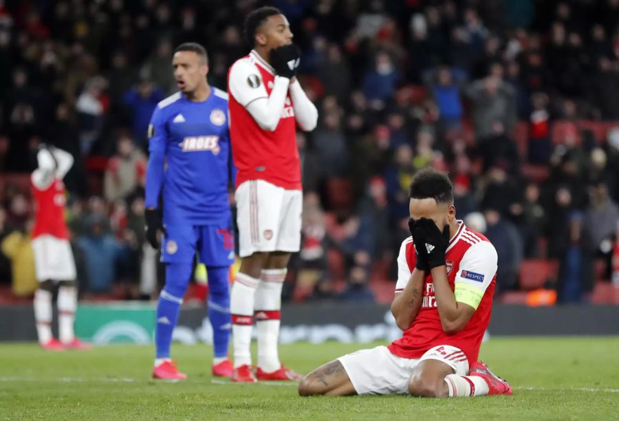 Arsenal's Pierre-Emerick Aubameyang reacts after losing the Europa League round of 32, second leg, soccer match between Arsenal and Olympiakos at Emirates stadium in London, England, Thursday, Feb. 27, 2020 . (AP Photo/Frank Augstein)