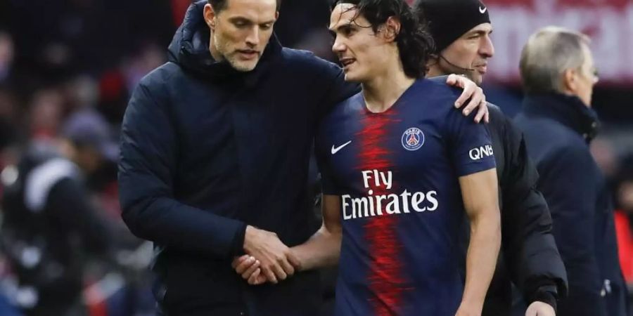 Trainer Thomas Tuchel (l) und Torschütze Cavani. Foto: Christophe Ena/AP