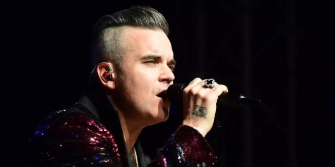 Robbie Williams will im nächsten Jahr ein Benefizkonzert geben. Foto: Ian West/PA Wire/dpa Robbie Williams will im nächsten Jahr ein Benefizkonzert geben. Foto: Ian West/PA Wire/dpa