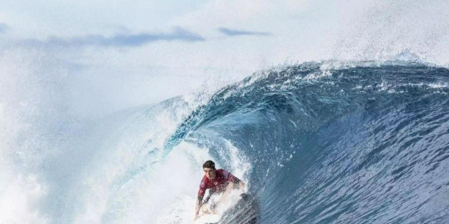 Der Surfspot Teahupoo hat eine der schönsten Wellen der Welt. Foto: Damien Poullenot/WORLD SURF LEAGUE/AAP/dpa