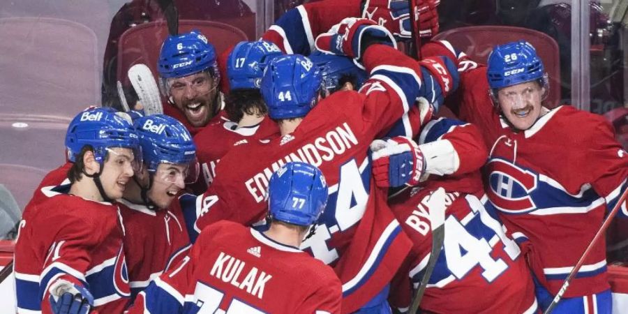 Die Spieler der Montreal Canadiens jubeln. Foto: Graham Hughes/The Canadian Press/AP/dpa