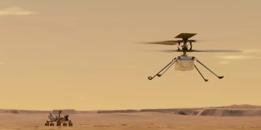 Just am 100. Jahrestag des ersten Helikopterflugs auf der Erde wird das Ereignis auf dem Mars wiederholt: Der Mini-Helikopter «Ingenuity» soll 90 Sekunden in der dünnen Mars-Atmosphäre navigieren. Links im Bild der Marsrover. (Nasa)