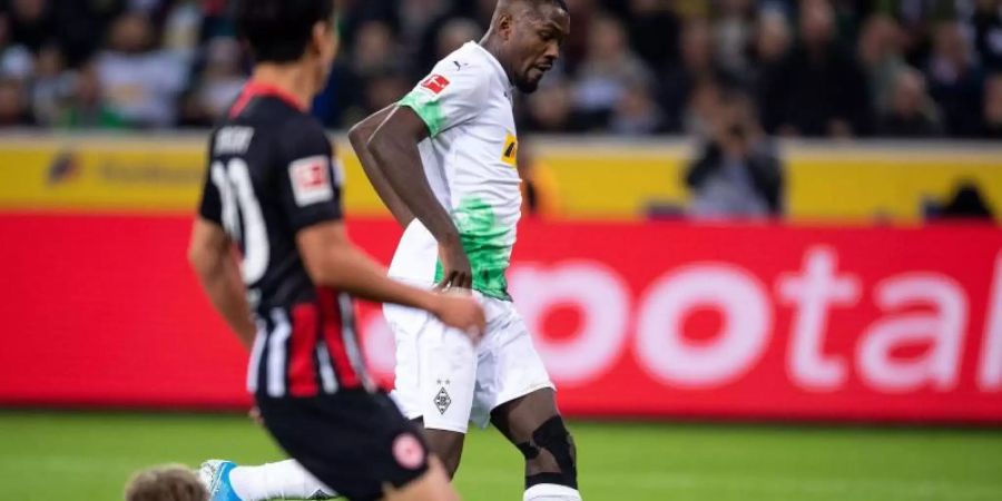Marcus Thuram (r) traf für Gladbach zum 1:0. Foto: Marius Becker/dpa