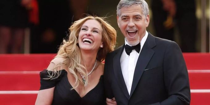Die US-Schauspieler Julia Roberts und George Clooney stehen gemeinsam vor der Kamera - als Ex-Eheleute. Foto: Ian Langsdon/EPA/dpa Die US-Schauspieler Julia Roberts und George Clooney stehen gemeinsam vor der Kamera - als Ex-Eheleute. Foto: Ian Langsdon/EPA/dpa
