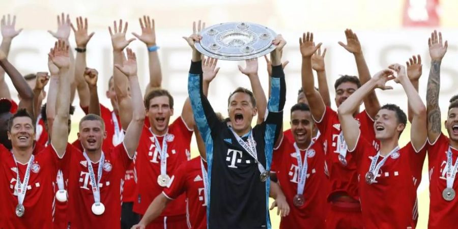 Holte sich zum achten Mal nacheinander die Meisterschaft in der Bundesliga: FC Bayern München. Foto: Kai Pfaffenbach/Reuters-Pool/dpa