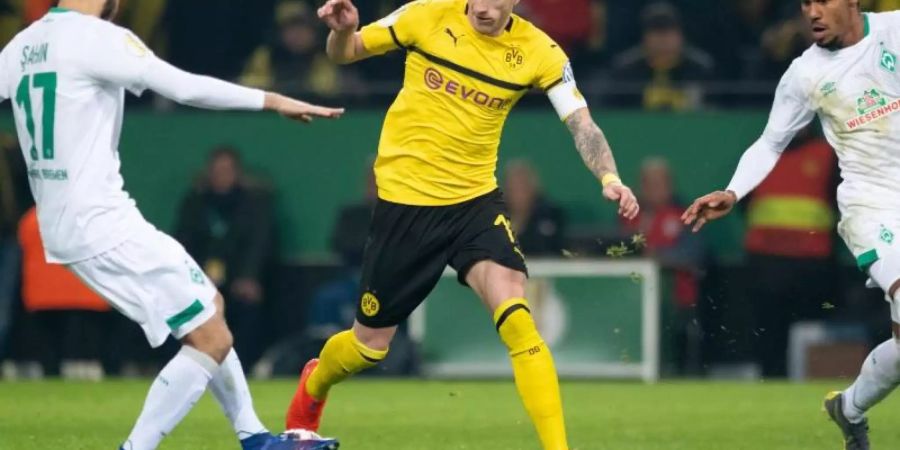 BVB-Kapitän Marco Reus (M) bei der Pokalpleite gegen Werder Bremen. Foto: Bernd Thissen