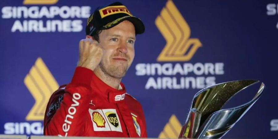 Nach 392 Tagen konnte Sebastian Vettel mal wieder ein Formel-1-Rennen für sich entscheiden. Foto: Vincent Thian/AP