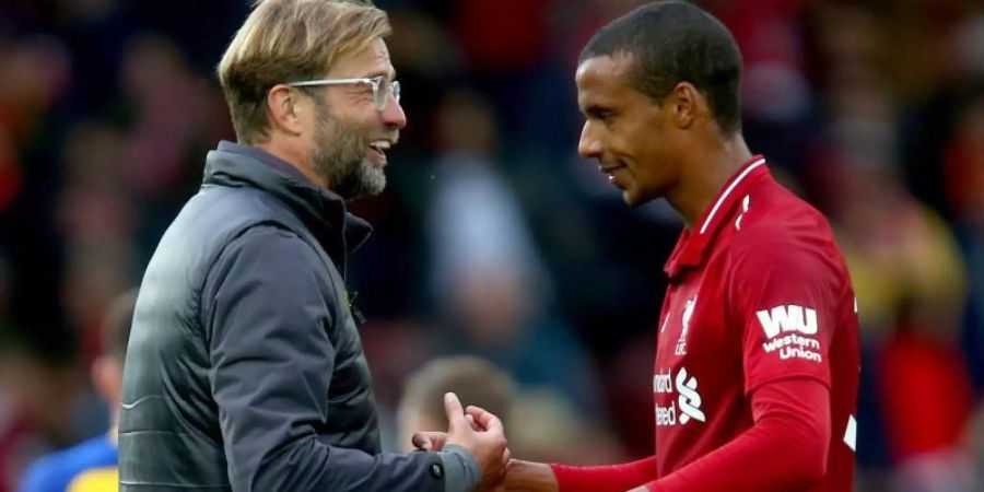 Liverpools Tainer Jürgen Klopp bedankt sich nach dem Schlusspfiff bei Joel Matip. Foto: Dave Thompson/PA Wire/dpa