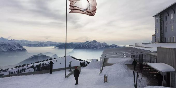 Eine Schweizer Fahne im Wind beim Berghotel Rigi-Kulm mit Blick auf den Pilatus. Der Wintertourismus in der Schweiz hat sich grösstenteils vom Coronavirus erholt. Coronavirus
