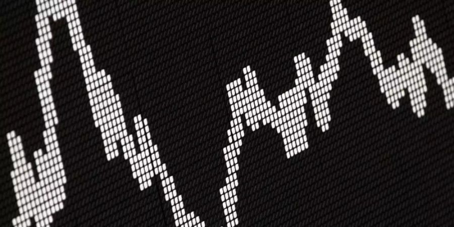 Der Deutsche Aktienindex (DAX) zeigt die Wertentwicklung der grössten deutschen Unternehmen. Foto: Frank Rumpenhorst/Illustration