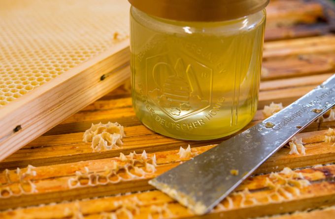 Honey jar honeycomb pieces light yellow transparent