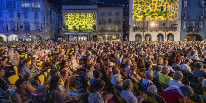 People sit on the Piazza Grande and watch a film at the pre-festival of the 75th Locarno International Film Festival.  The festival runs from August 3rd to 13th, 2022.