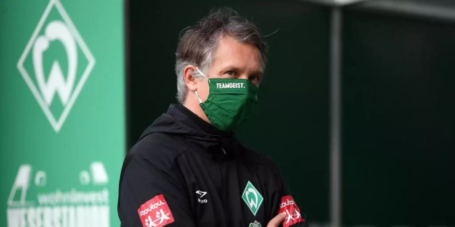Sportdirektor von Werder Bremen: Frank Baumann steht mit Maske im Stadion. Foto: Stuart Franklin/Getty Images Europe/Pool/dpa