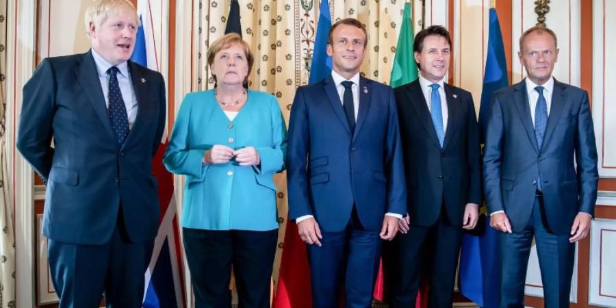 Der britische Premierminister Boris Johnson (l-r), Bundeskanzlerin Angela Merkel, Frankreichs Präsident Emmanuel Macron, der italienische Ministerpräsident Giuseppe Conte und EU-Ratspräsident Donald Tusk beim G7-Gipfel in Biarritz. Foto: Michael Kappeler