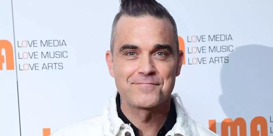 Robbie Williams freut sich auf die Vorweihnachtszeit. Foto: Ian West/PA Wire/dpa