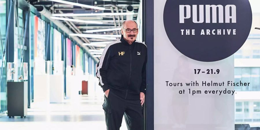 Helmut Fischer, früherer Marketing-Chef und heutiger Archivar des Sportartikel-Herstellers Puma, steht in einer Halle des Unternehmens in Herzogenaurauch (D).