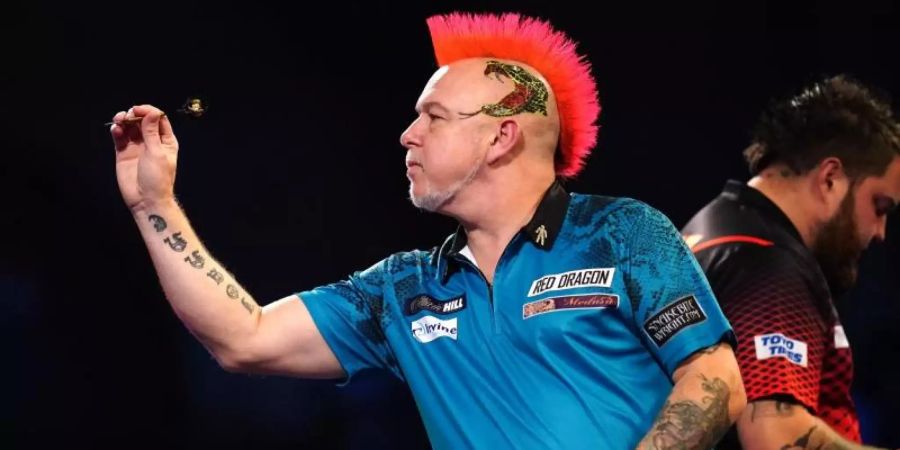 Darts-Weltmeister Peter Wright in Aktion. Foto: John Walton/PA Wire/dpa