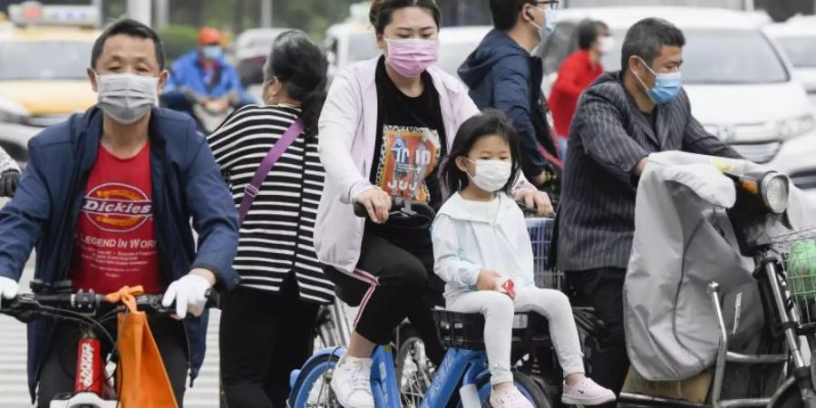 Menschen in Wuhan, dem ersten Epizentrum der globalen Corona-Pandemie. Foto: -/kyodo/dpa