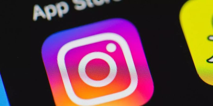 Das Logo von Instagram auf einem Apple iPhone. Foto: picture alliance / dpa