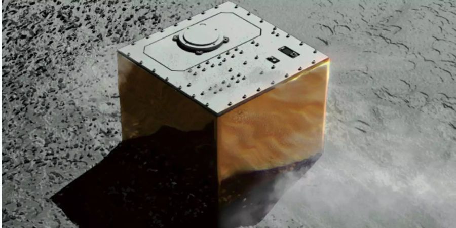 Diese von der japanischen Raumfahrtbehörde (JAXA) zur Verfügung gestellte Computergrafk zeigt das deutsch-französische Messgerät «Mascot» auf dem Asteroiden Ryugu.