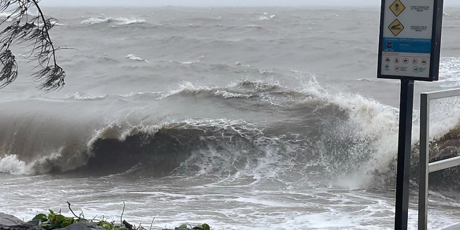 A supplied image obtained on Wednesday, December 13, 2023, shows heavy waves at Trinity Beach in Cairns. People are bunkering down and authorities are on high alert as Tropical Cyclone Jasper is on the verge of crossing the Queensland coast as a category 2 system. (AAP Image/Supplied by myPolice Greater Cairns) NO ARCHIVING, EDITORIAL USE ONLY