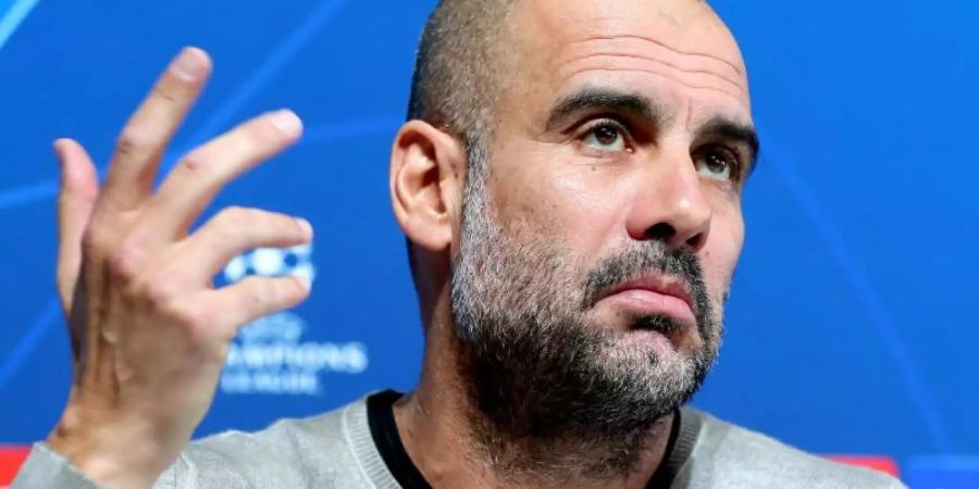 Pep Guardiola, Trainer von Manchester City, reagiert auf die Fragen der Journalisten. Foto: Martin Rickett/PA Wire/dpa