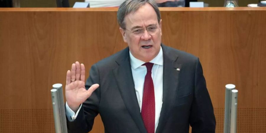 «Wir alle hatten die Hoffnung, aus der Erfahrung des letzten Jahres, dass wenn der Frühling kommt, es wärmer wird, die Virus-Ansteckung zurückgeht», sagt Armin Laschet. Foto: Federico Gambarini/dpa
