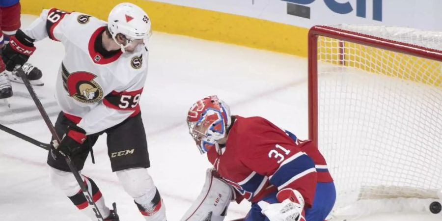 Montreal Canadiens Goalie Carey Price (r) in Aktion mit Alex Formenton von den Senators. Foto: Graham Hughes/The Canadian Press via ZUMA/dpa