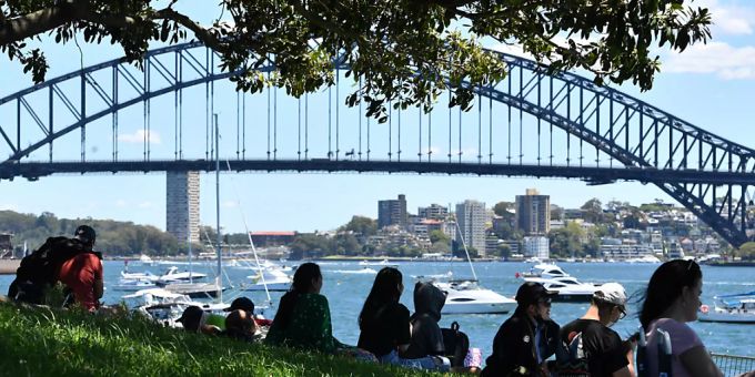 Small crowd numbers are seen gathered at Mrs Macquaries Chair ahead of New Years Eve celebrations in Sydney, Friday, December 31, 2021. Fireworks at 9pm and midnight will be displayed against the backdrop of the Sydney Opera House and Sydney Harbour Bridge with crowd numbers expected to be low due to increasing COVID 19 case numbers with more than 21,000 infections recorded in the past 24 hours. (AAP Image/Dean Lewins) NO ARCHIVING Small crowd numbers are seen gathered at Mrs Macquaries Chair ahead of New Years Eve celebrations in Sydney, Friday, December 31, 2021. Fireworks at 9pm and midnight will be displayed against the backdrop of the Sydney Opera House and Sydney Harbour Bridge with crowd numbers expected to be low due to increasing COVID 19 case numbers with more than 21,000 infections recorded in the past 24 hours. (AAP Image/Dean Lewins) NO ARCHIVING