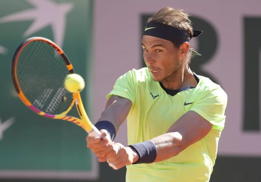 Spain's Rafael Nadal plays a return to Australia's Alexei Popyrin during their first round match on day three of the French Open tennis tournament at Roland Garros in Paris, France, Tuesday, June 1, 2021. (AP Photo/Christophe Ena)