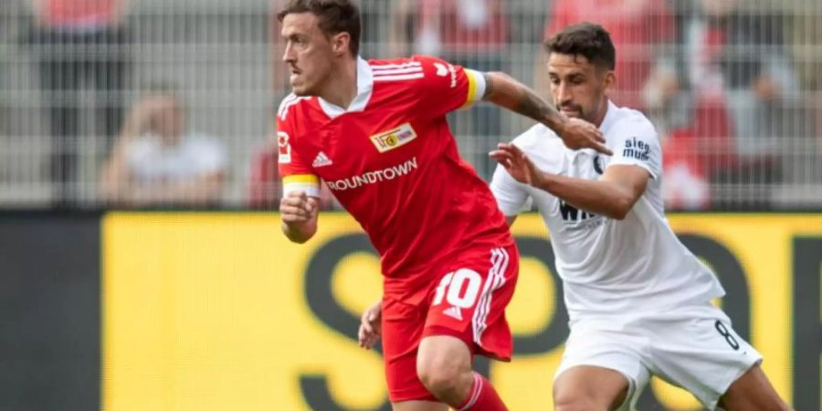 Konnte die Union-Niederlage gegen Augsburg nicht verhindern: Max Kruse (l). Foto: Andreas Gora/dpa