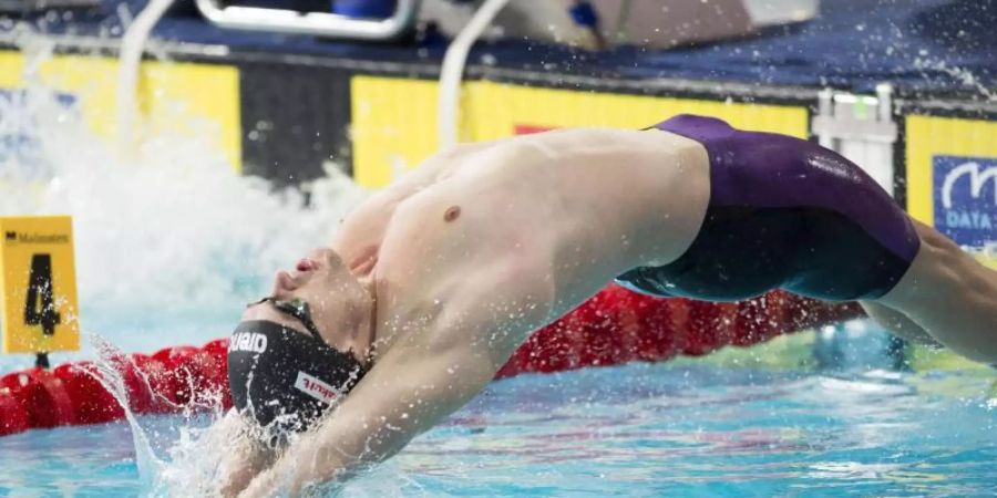 Rückenschwimmer Christian Diener freut sich über den zweiten Platz seines Teams. Foto: Ian Rutherford/PA Wire/dpa