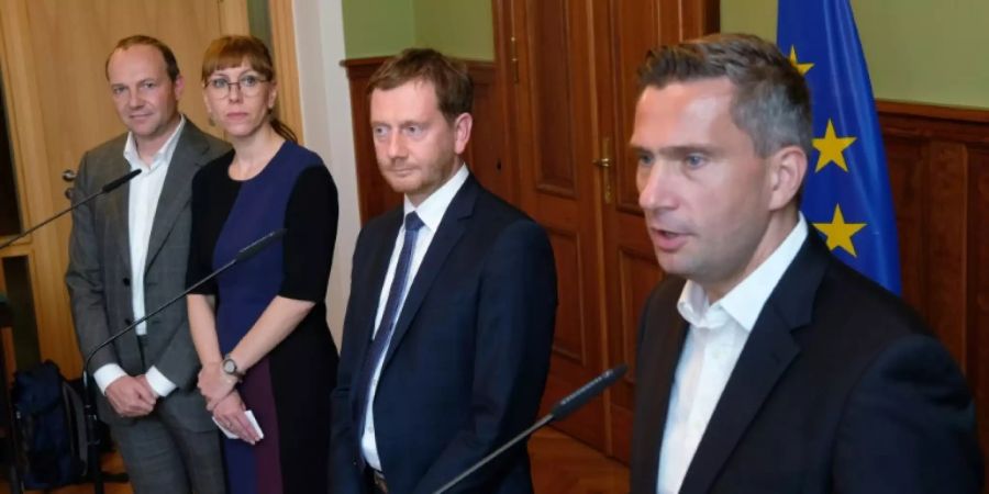 Die Spitzen von Grünen, CDU und SPD
