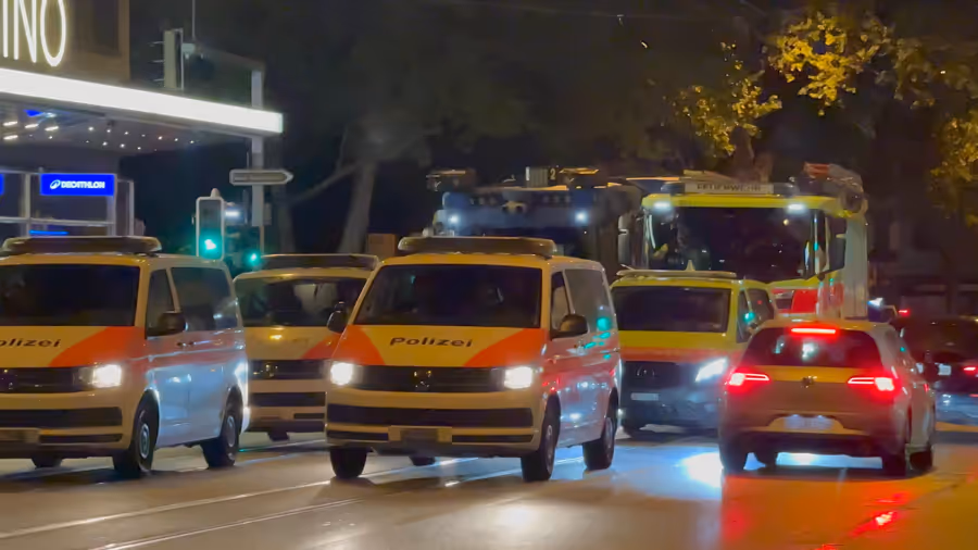 Zurich police cars at the scene of the illegal rave.