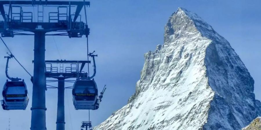 Viele Kantone in der Schweiz schliessen wegen der Corona-Pandemie ihre Skigebiete. Foto: Jamey Keaten/AP/dpa