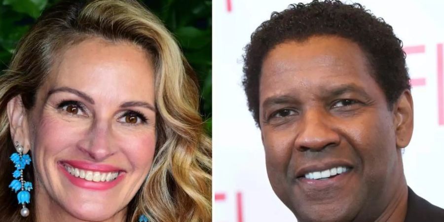 Julia Roberts und Denzel Washington stehen gemeinsam vor der Kamera. Foto: Ian West/PA Wire/dpa