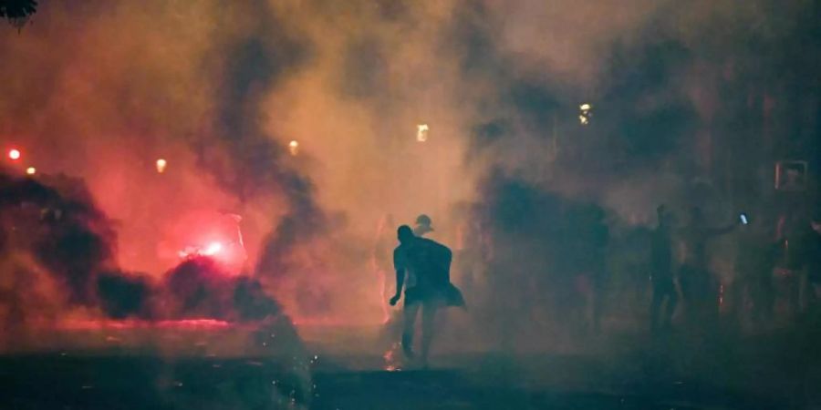 In Paris kam es zu Ausschreitungen. Foto: Alain Jocard/AFP/dpa
