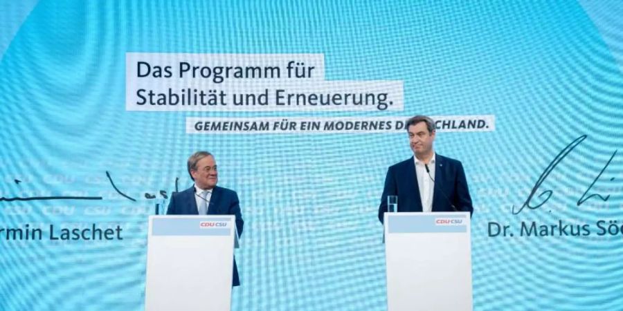 CDU-Chef Armin Laschet und CSU-Chef Markus Söder stellen das Programm für die Bundestagswahl vor. Foto: Kay Nietfeld/dpa