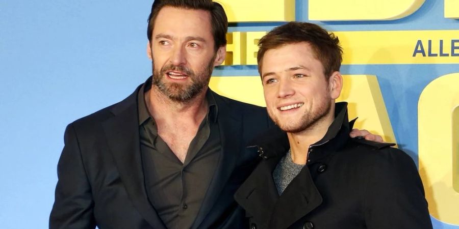 Hugh Jackman (l.) und Taron Egerton bei einer Vorführung von «Eddie the Eagle» im Jahr 2016 in München.