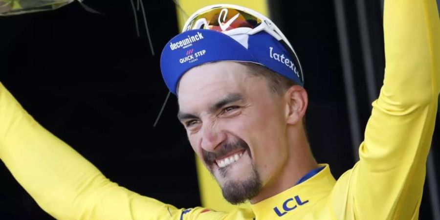 «Ich will dieses Maillot Jaune so weit tragen, wie es nur geht», sagt Alaphilippe. Foto: Christophe Ena/AP