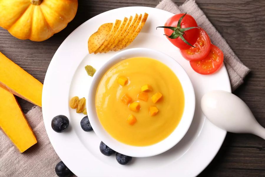 Mus Obst orangefarben Heidelbeere Kürbis Tomate