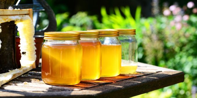 honey harvest board jars of sun