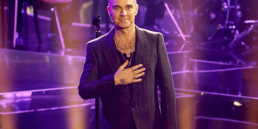 Der britische Popstar Robbie Williams wird nächstes Jahr als Headliner auf dem königlichen Landsitz Sandringham auftreten.