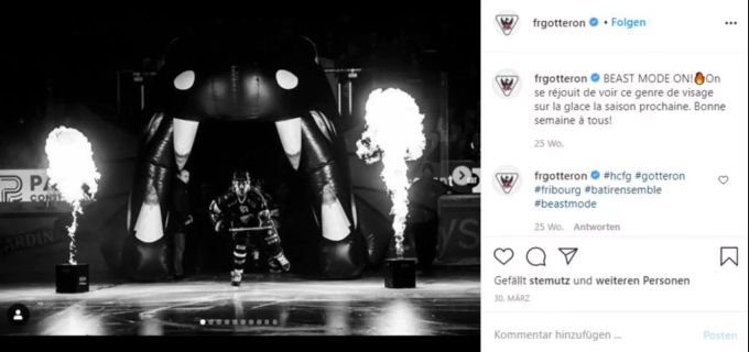 Die Spieler von Fribourg Gottéron kommen durch einen Drachen auf das Eis. Fribourg Gottéron